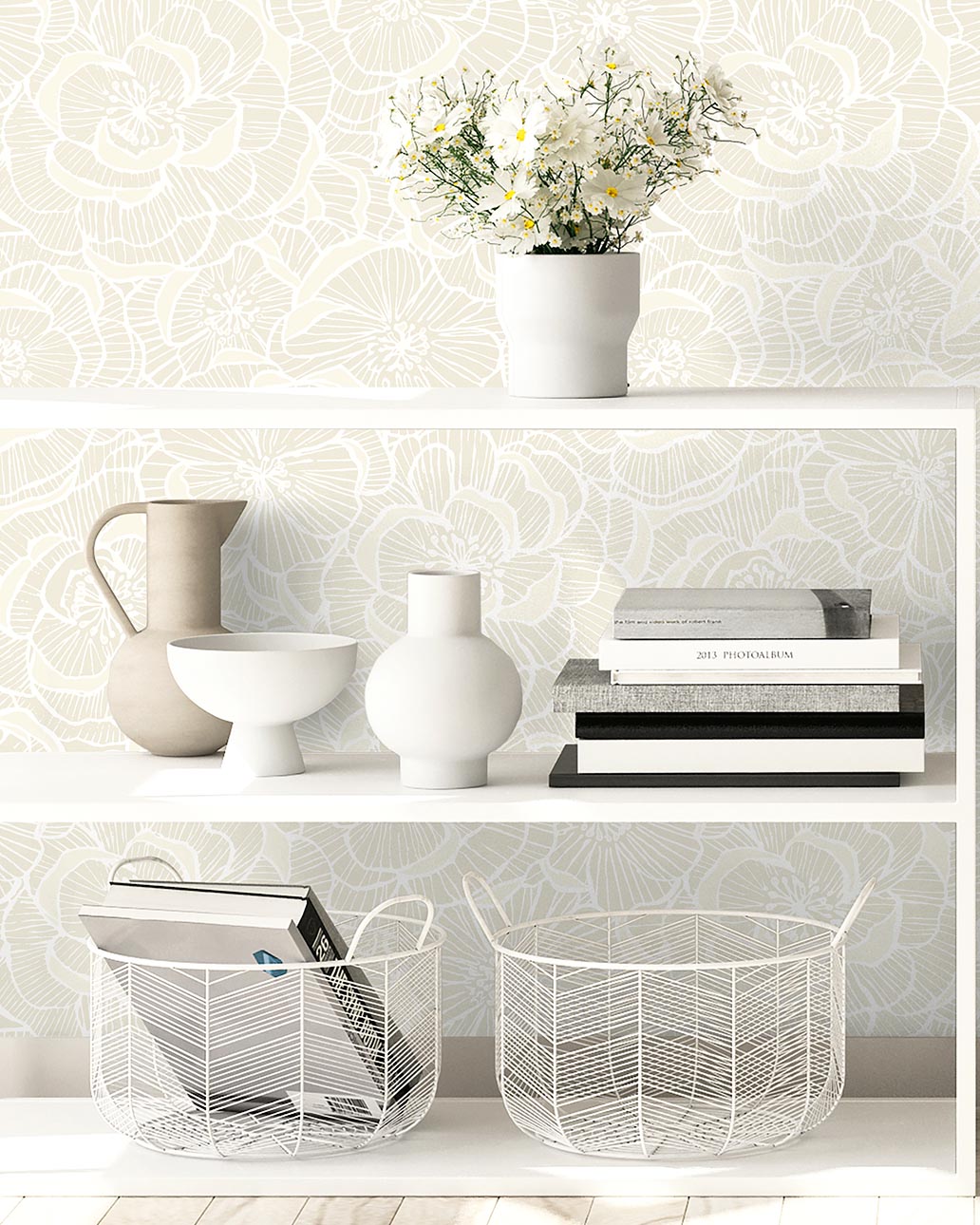 White shelves with decorative items against a patterned wallpaper.
