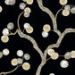 Decorative pattern of branches and leaves on a black background