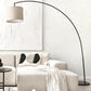 Modern living room with a beige sectional sofa, floor lamp, and decorative pillows.