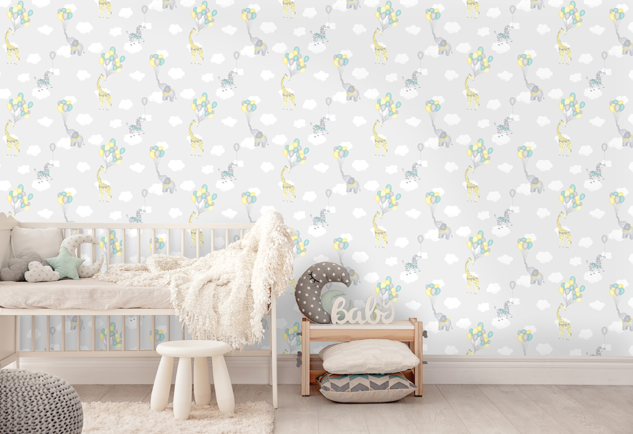The Animal Balloons Grey Wallpaper features giraffes, elephants and zebras flying with balloons through the clouds. Ideal for playrooms and children’s bedrooms.