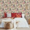 Aruba Cream wallpaper is a stunning bird trail design featuring floral and fruit elements, on a painterly matt background. Perfect for a feature wall.