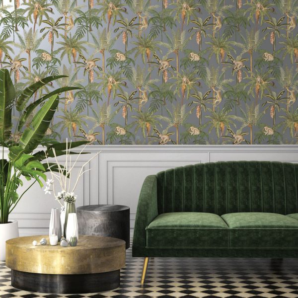 Ateles Silver Wallpaper is a painterly tropical-themed wallpaper featuring spider monkeys climbing 0n palm trees, set on a metallic background.