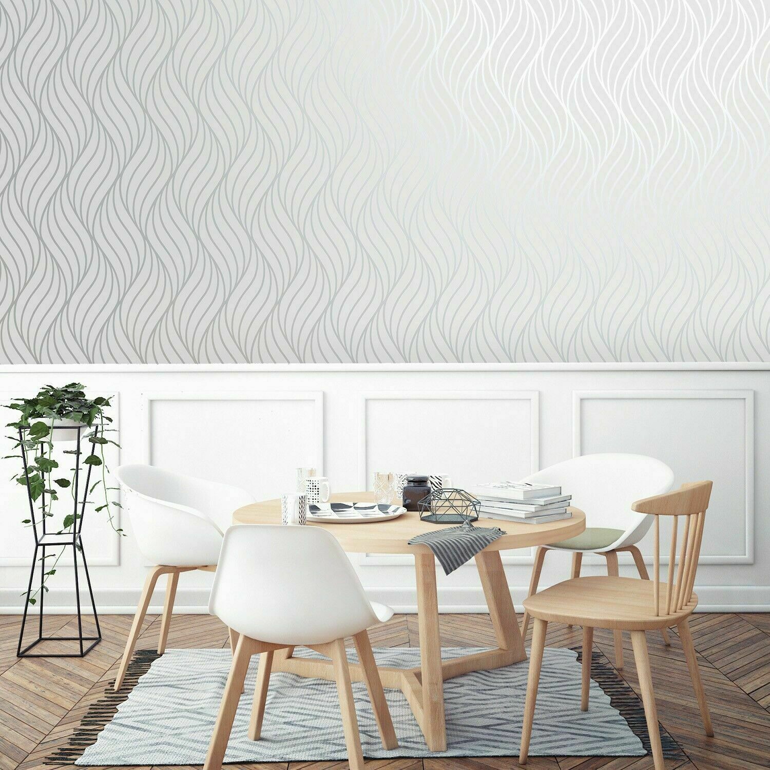 With a matt white background and a contrasting, high-shine wave design in metallic silver, the Alderney Grey/Silver Wallpaper is a stunning choice for opening up smaller rooms, creating a sense of space and light.