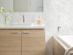 The Glitter Marble Tile Wallpaper willAdd a stylish, contemporary touch to your kitchen or bathroom with this textured marble tile wallpaper, shown here in creamy white with sparkling sprinkles of glitter.
