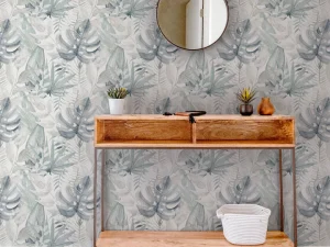 Chalky Tropical wallpaper features a gorgeous mix of leaves in light navy tones upon a crisp, white matt paper.