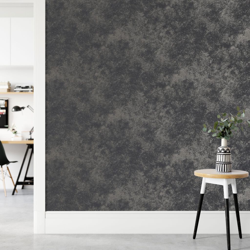 Gilded Concrete Onyx wallpaper is an elegant textured design, with a distressed concrete effect which is highlighted with metallic hues.
