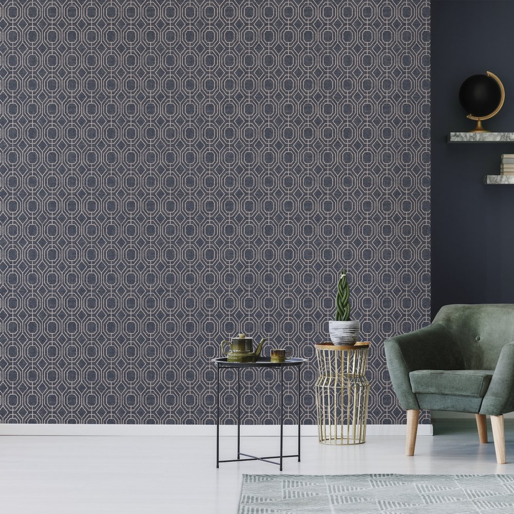 Luxe Geo Navy wallpaper is set upon a textured base for a luxurious look, with the gold geometric detail to give it extra sophistication.
