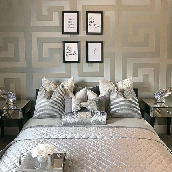 Versace Greek Key Champagne Wallpaper is minimal yet bold. The design represents the iconic Versace Greca pattern and will have a strong impact in any space