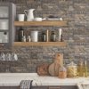 Stone Cladding Natural Wallpaper is a faux stone wall design that has stacked stones in a perfect pattern and gives the appearance of a real stone wall.