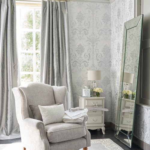 Josette Metallic Silver Wallpaper is an ornate and elegant damask featuring chandeliers and rose bouquets in stylish and sparkly silver metallic tones.