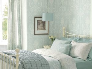 Josette Duck Egg Wallpaper is an ornate and elegant damask featuring chandeliers and rose bouquets and looks fresh and modern with a duck egg background.