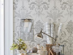Josette Dove Grey/White Wallpaper is an ornate and elegant damask featuring chandeliers and rose bouquets in the stylish combination of dove grey and white.