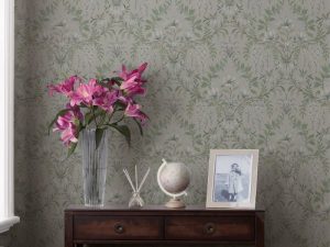 Parterre Sage Wallpaper is a beautiful and sophisticated floral featuring painted white flowers and swirling patterns of leaves.