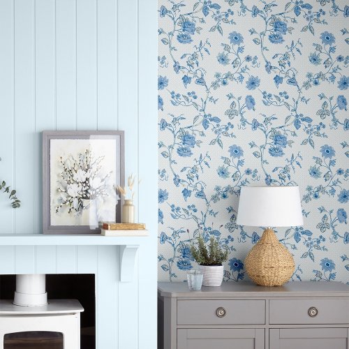 Rambling Rector Blue Sky Wallpaper is a beautifully delicate floral print, featuring fine meandering stems with offshoots of dainty flowers and leaves.