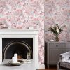Birtle Blush Wallpaper features charming birds perched upon exotic tree branches alongside blooming roses and poppies with natural glamour.