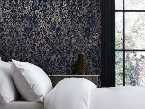 Majestic Damask Navy Wallpaper is a luxurious design which features an intricate, detailed damask in rose gold metallic sat upon a deep navy background.