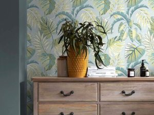 Jungle Leaves Duck Egg Wallpaper features an array of tropical leaves sat upon a soft duck egg backdrop with tones of neutrals, deep blues and sage greens.