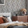 Kaleidoscope Champagne Wallpaper is a geometric design that has the feel of an optical illusion which creates depth into the design, finished off with a metallic embellishment that gives a touch of luxury.