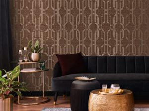 Indulgent Geo Ruby Wallpaper is a new design featuring interlinked ovals with an opulent gilded texture running throughout the background.