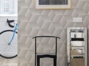Quibist Taupe Wallpaper is a geometric 3D pattern with a textured finish shown here in a taupe colourway for a contemporary and modern look.