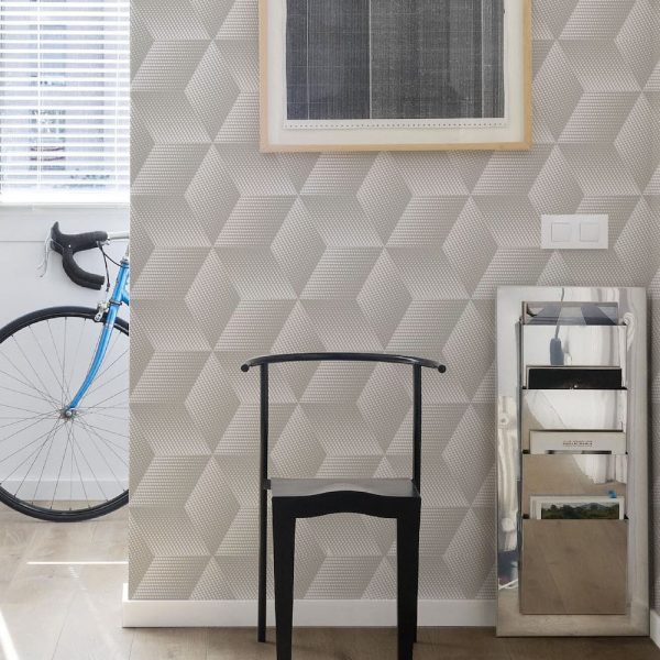 Quibist Taupe Wallpaper is a geometric 3D pattern with a textured finish shown here in a taupe colourway for a contemporary and modern look.